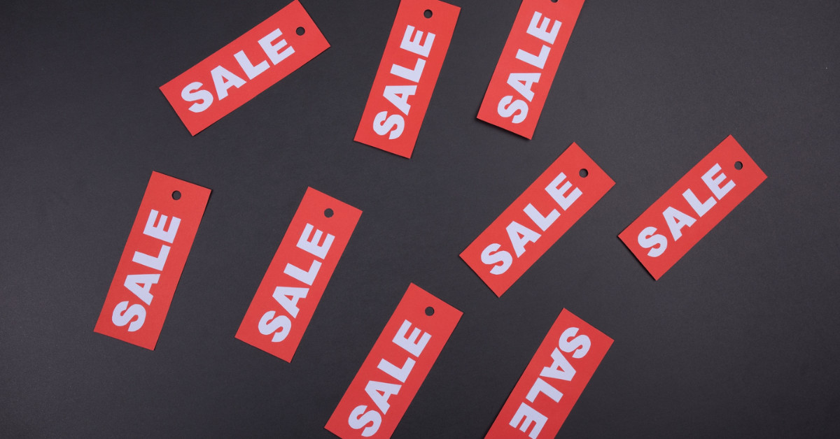 DTC sale tags on a black background.